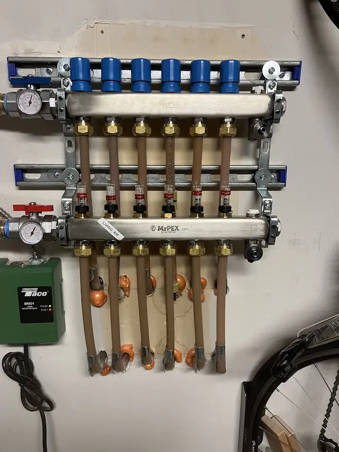 Plumber performing Water Heater Repair at a residential property in Woolwich